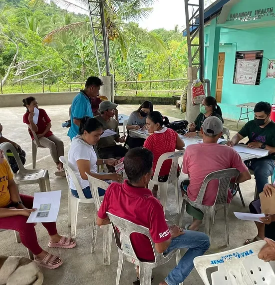 Rosario municipal personnel assisting farmers in a barangay